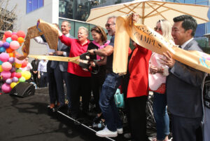 Mayor Eric Garcetti, Lorri L. Jean, Anita May Rosenstein, City Councilmember David Ryu, and other participants cutting the ribbon to open the Los Angeles LGBT Center’s Anita May Rosenstein Campus, Los Angeles, CA, April 17, 2019.