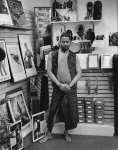 Dale posing in his store A.N.D. (art-n-design), an afro-centric LGBT arts/gift store in Baltimore, MD, 1996. Photo courtesy of Dale Guy Madison.
