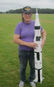 Monica with her white model rocket, Saturn V. Photo courtesy of Monica Helms.