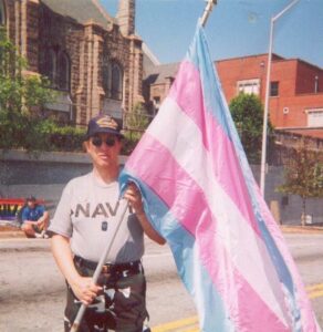 Monica holding the Transgender Pride Flag that she designed at Pride, Atlanta, GA, 2001. Photo courtesy of Monica Helms.