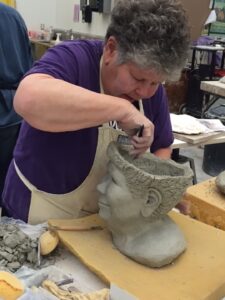 Judith sculpting her “Brain Surgery” piece, 2016.