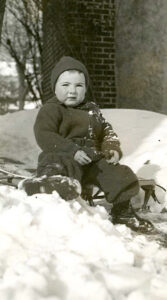 Margaret (age ~4), sitting outside on a sled in the snow, 1940. Photo courtesy of Margaret Randall.