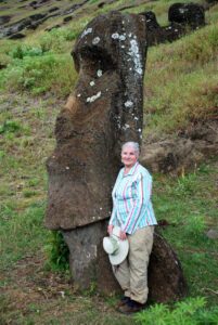 Margaret on Easter Island, Chile, 2007. The rock formation she stands next to has been carved into a face. Photo courtesy of Margaret Randall.