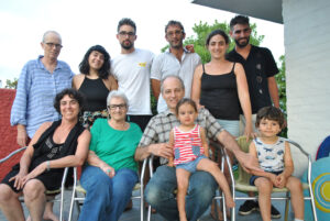 Margaret Randall (in a green t-shirt) and her wife Barbara Byers with Gregory Randall (son) and Laura Randall (daughter-in-law); Lia, Martín, and Danny Randall (grandchildren) and their significant others; and Guille and Emma Randall (great-grandchildren) in Uruguay, 2019. Photo courtesy of Margaret Randall.