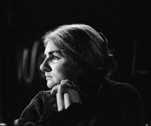 A pensive portrait of Margaret leaning on her interlaced fingers. Photo Credit: Bud Schultz. Photo courtesy of Margaret Randall.