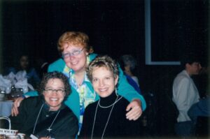 Esther Rothblum hugging Nanette Gartrell and Dee Mosbacher during the Lesbian Health Research Center Annual Gala Benefit, where she was honored with the Lesbian Health Research Award, San Francisco, CA 2004. Photo courtesy of Esther Rothblum.