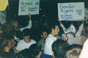 Riki speaking through a megaphone during the Creating Change Task Force protest over mistreatment of an African-American trans woman by Oakland police, San Francisco, CA, 1999.