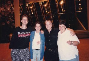 Riki (wearing a t-shirt that reads “Transsexual Menace”), Gina Reiss (then Action Vice President of National Organization for Women/New Jersey Chapter), Wendy Burger the NOW/NJ Lesbian Rights Task Force Director), and Leslie Feinburg (trans rights activist and author of Stone Butch Blues) at the NOW/NJ annual conference, 1993. 