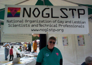 Shelley staffing the NOGLSTP table at Pasadena Pride, Pasadena, CA, 2000. Photo Credit: Barbara Belmont. Photo courtesy of Shelley Diamond.