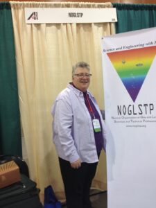 Shelley staffing the National Organization of Gay and Lesbian Scientists and Technical Professionals (NOGLSTP) booth at the Advancing Indigenous People in STEM (AISES) conference in Phoenix, AZ, November 2015. Photo courtesy of Shelley Diamond.