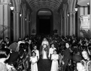 Oliva’s mother walking herself down the aisle at her wedding. Espin shared, “Being a strong woman was something that was okay to do in my family. My mother walked into the church to get married by herself because she did not want anyone to give her away.” Photo courtesy of Oliva Espín.