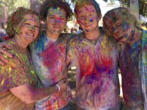 L-R: Michele (sister), Dante (nephew), Donovan (nephew) and Mike Szymanski covered in colored powder, May 2018. Photo courtesy of Mike Szymanski.