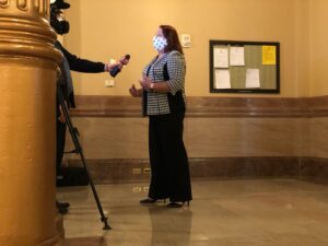 Stephanie speaks to reporters inside the Kansas Capitol in Topeka, Kansas, 2021. Photo courtesy of Stephanie Byers.