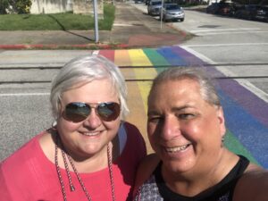 Stephanie and Lori at the Rainbow Crosswalk in Galveston, Texas, 2021. Photo courtesy of Stephanie Byers.