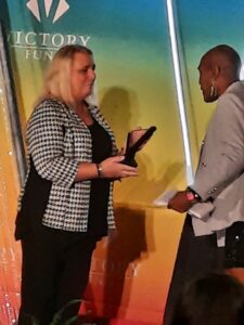 Stephanie presents the LGBTQ Leaders Hall of Fame award to Andrea Jenkins, in Washington, DC, 2021. Photo courtesy of Stephanie Byers.