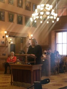 Stephanie gives testimony in committee on a bill to repatriate a Native American cemetery to the Shawnee Tribe, at the Kansas State Capitol in Topeka, Kansas, 2022. Photo courtesy of Stephanie Byers.