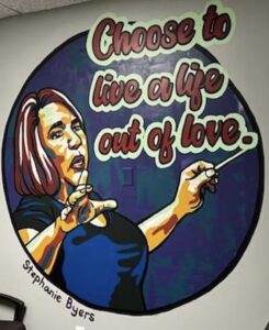 Mural of Stephanie Byers “Choose to live a life out of love” found within exam room 1 at M-Care Healthcare Clinic in Wichita, Kansas. Mural credit: Heather Byers, Stephanie’s daughter-in-law. Photo courtesy of Stephanie Byers.