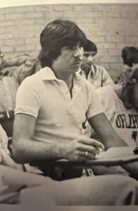 Sepia-tones photo of Stephanie in High School Choir at a desk among peers inNorman, Oklahoma, 1980. Photo courtesy of Stephanie Byers.