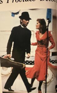 Yearbook photo of Stephanie Byers (black suit with guitar) in “Anything Goes performed at Norman High School in Norman, Oklahoma, 1980. Photo courtesy of Stephanie Byers.