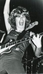 Grayscale photo of Cidny performing on stage at Whiskey A Go-Go, Hollywood, CA, 1979. Photo Credit: Donna Santisi. Photo courtesy of Cidny Bullens.