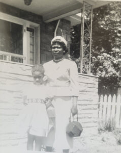 Betty (left, age ~5) and her mother standing in front of their house in Seattle, WA. Photo courtesy of Betty Berrysmith.