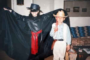 Halloween photo of Aiden (dressed in black as Zorro) and brother Stefen Aizumi in their grandparent’s living room. Temple City, CA, 1996. Photo courtesy of Marsha Aizumi.