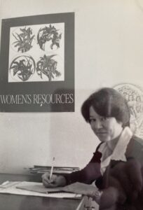 Grayscale photo of Monica Wehrle in her Women’s Bureau/Resources office in Fort Wayne, Indian, 1980. Photo Courtesy of Harriet Miller and Monica Wehrle.
