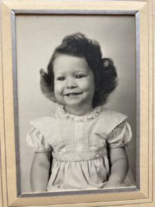 Toddler grayscale  portrait of Monica Wehrle. Fort Wayne, Indiana, 1951. Photo Courtesy of Harriet Miller and Monica Wehrle.