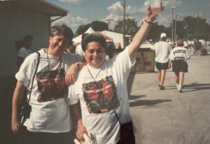 Monica Wehrle and Harriet Miller cheerfully wave at a “Run, Jane, Run” event in Fort Wayne, Indiana, 1994. Photo Courtesy of Harriet Miller and Monica Wehrle.