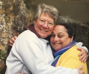 Monica Wehrle and Harriet Miller joyfully embrace while traveling the Czech Republic together, 2003. Photo Courtesy of Harriet Miller and Monica Wehrle.