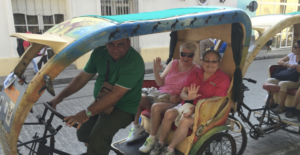 Harriet Miller and Monica Wehrle in the back of a street pedal cab on a Cuban Oats Tour. Cuba, 2016. Photo Courtesy of Harriet Miller and Monica Wehrle.