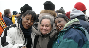 Harriet Miller (middle) with various joyful members of the crowd at President Barack 
Obama’s Inauguration in warm winter jackets in Washington, D.C. 2009. Photo Courtesy of Harriet Miller and Monica Wehrle.