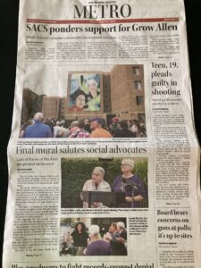 Front page of the Metro Newspaper recognizing the Community building-Mural of Harriet Miller and Monica Wehrle being unveiled to a crowd of people. In Fort Wayne, Indiana, 2023. Photo Courtesy of Harriet Miller and Monica Wehrle.