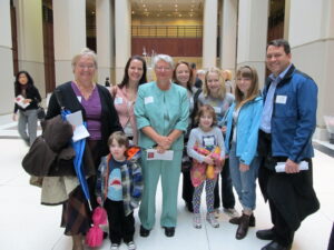 Harriet Miller and Monica Wehrle smile with three generations of their Wehrle family members in Indianapolis, Indiana, 2011. Photo Courtesy of Harriet Miller and Monica Wehrle.
